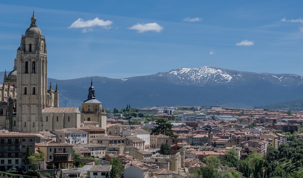 Photo of the rooftops of Madrid, Spain with the Sierra de Guadarrama mountains in the distance